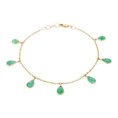 This is part of Chairish’s Fine Jewelry assortment.  This Emerald Charm Chain Bracelet in 18K gold showcases 7 endlessly sparkling natural emerald, weighing 3.5 carat. It measures 7.25 inches long in length.  Emerald enhances intellectual capacity of the person. Designed with perfect pear cut dangling emerald attached to chain to make you stand out on any occasion or event. The minimalist style of the bracelet complements the attire beautifully and is a perfect gift for anyone on your list. Yellow Gold Emerald Bracelets For May Birthstone, Emerald Yellow Gold Bracelets For May Birthstone, Emerald Yellow Gold Bracelet For May Birthstone, Charm Chain, Emerald Gemstone, Natural Emerald, Pear Cut, Minimalist Style, Chain Bracelet