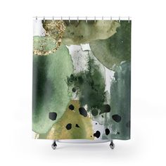 an abstract shower curtain with green and black paint on the watercolor paper, featuring trees