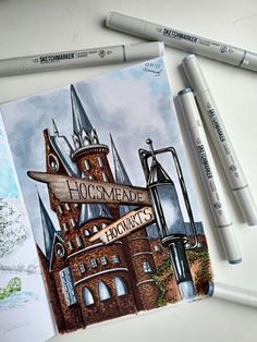 a drawing of hogwart's castle with two markers