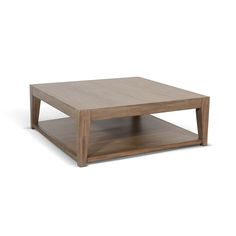 a square wooden table sitting on top of a white floor