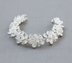 "I designed this statement bracelet for the bride who wants to sparkle on her wedding day! It is made with cubic zirconia and wired with lots of sparkly Swarovski crystals. It is .75\" or about 2 cm wide. The standard size of this bracelet is 7 inches and slightly adjustable. I make it by hand so if you need a different size you can indicate your wrist size or bracelet size in the note to seller. I love to customize so please contact me if you are interested in adding any gemstones! The earrings Bracelet Wedding, Swarovski Crystal Bracelet, Bridal Bracelet, Statement Bracelet, Crystal Bracelet, Wedding Bracelet, Bridesmaid Jewelry, Jewelry Diy, Crystal Bracelets