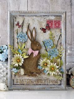 a card with an image of a rabbit and flowers