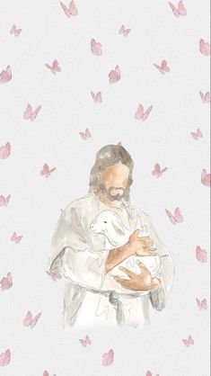 a man holding a baby in his arms surrounded by pink butterflies