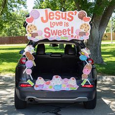 the back of a car with a sign on it that says jesus love is sweet