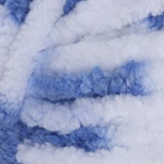 blue and white clouds are seen in this aerial view from the plane's window