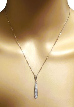 This is such a beautiful diamond pendant. It's very classy. It is on a beautiful 14k white gold chain that measures 17 inches. It has 49 diamonds including one on the "Love" tag charm that is attached to the chain. It is stamped 14k LJ, which stands for Legend Jewelers. The pendant itself is 1.34 inches long and 4.6 mm wide. It is pre-owned but in New condition. You can dress it up or down. It's really quite an elegant piece. The combined weight in grams is 3.22. Just an excellent all around pie