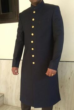 Traditional Indian wedding golden 8 button groom and groomsmen sherwani made in black color pure polyester fabric. It has bottom as matching black trouser. We are given sizes according chest measurements - 34, 36, 38, 40, 42, 44, 46, 48, 50 and custom made For custom made order:- You should select custom made option from size box then place the order. After received your order we will send you a measurement form. You can send us your measurements within one or two days after your order. We don't Traditional Black Suit For Groom, Black Nehru Jacket For Wedding With Traditional Drape, Traditional Black Kurta For Groom, Traditional Drape Black Kurta For Groom, Black Dabka Sherwani For Groom, Black Long Sleeve Sherwani For Groom, Black Bandhgala For Groom With Traditional Drape, Black Long Traditional Wear For Wedding, Black Long Sleeve Traditional Wear For Groom