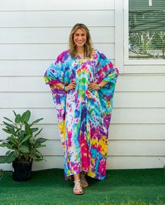 Add a touch of unique style to your wardrobe with our Hand-Dyed Kaftan Dress! This stunning dress is made from 100% breathable and comfy rayon fabric, ensuring maximum comfort all day long. Using our unique method, each dress is carefully hand dyed, resulting in a one-of-a- kind masterpiece. The intricate patterns and vibrant colors make this dress a true work of art. The kaftan dress comes in a versatile one size fits most (M-3XL), making it extremely comfortable for a wide range of body types. With a bust measurement of up to 60", you can feel confident that this dress will flatter your figure. The dress measures 55" in length and 45" in width, providing a loose and flowing fit that is both stylish and flattering. Featuring a trendy V-neck design and side slits, this slipover style dress Oversized Multicolor Dresses For Beach Season, Bohemian Multicolor Dress, Hippie Multicolor Free Size Kaftan, Tie Dye Free Size Kaftan For Beach, Tie Dye Free Size Beach Kaftan, Beach Tie-dye Free Size Kaftan, Relaxed Fit Multicolor Kaftan For The Beach, Tie Dye Free Size Kaftan For Vacation, Tie-dye Beachwear Kaftan For Festival