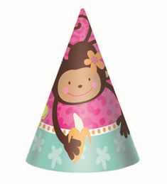 a pink and blue party hat with a monkey on it's face, sitting in front of a white background