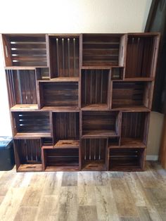 a large wooden shelf with many compartments on it