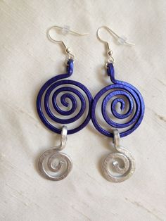 New, handmade for you in Puerto Rico by AlexaSofia. These earrings are lightweight and comfortable. Hammered for texture and strength. Includes earnut. Colors: Silver and Dark Blue. I love this combination. Measurement: 3 1/4" long and 1 1/8" wide approximately.  Contact me if you prefer a different length. Made of non-tarnish aluminum. I use good quality materials. All my wire is long lasting. The item in the picture is a model sample. As with many handmade items, slight differences may occur. My metal collection is designed so that you can mix and match items. Please see my other listings for other colors and matching items. ~Please observe photos for details and condition. ~Contact me for questions before purchasing. ~Will ship the next day via USPS with tracking information. ~Comes fro Aluminum Wire Earrings, Handmade Gift For Mom, Metallic Earrings, Artisan Jewelry Earrings, Hammered Metal, Handcrafted Artisan Jewelry, Metal Earrings, Silver Blue, Matching Items