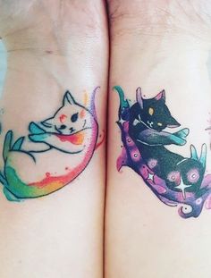 two cats tattoo on both wrist and arm, one with a cat sitting on the other