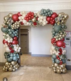 an arch made out of balloons and other decorations