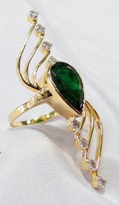 18 k solid gold Natural pear shape Emerald and Diamond set Ring. The beautiful long ring is great for any collection. USA ring size-7.5 ( we can adjust to any size), size of top-5/1.8 cm, weight-8.320 grams, material- 18 K solid gold, natural emerald, Diamonds. with IGI certificate). Elegant Gold Pear-shaped Emerald Ring, Emerald Ring Vintage, Long Ring, Emerald Rings, Emerald Diamond Ring, Set Ring, Diamond Set, Natural Emerald, Emerald Diamond