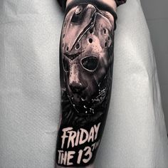 a man with a tattoo on his arm that says friday the 13th and a hockey mask