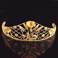 Exquisite yellow and green gold tiara with steep graduation to a central realistically modelled floral motif with trellace work either side and further flora and leaf decoration Henri Sandoz, circa 1900 Tiaras Jewellery, Leaf Decoration, Hair Adornments, Art Nouveau Jewelry