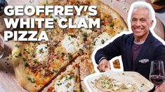 a man holding a plate with pizza on it and the words geoffey's white clam pizza