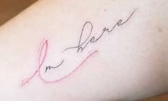 a woman's arm with the word love written in cursive writing on it