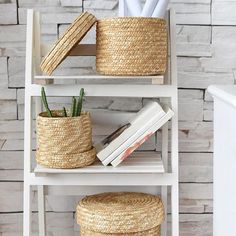 a shelf with baskets and books on it