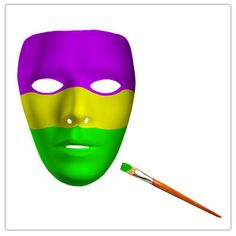 a purple, yellow and green mask with a paintbrush next to it on a white background