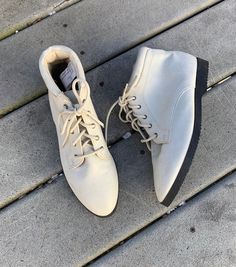 Real leather. These babies are great! Super well constructed, great mini laces. No major flaws but does have some cosmetic marks on the white, this could be cleaned up a bit but it's nothing huge. Barely any wear on the soles. These look pretty narrow so I would say they would fit a narrow foot best. Womens 7. Price reflects damage.  All sales final. Note: items are described as accurately as possible and vintage items are sized differently than clothing now. PLEASE make sure you check the measurements I have provided in order to make the best purchasing decision. Vintage clothing may show signs of general wear. All of my items are used unless otherwise stated. If there are holes, rips or tears I will mention them in the main description. As always, feel free to ask questions! Vintage Leather Booties, Vintage Beige Closed Toe Boots, White Lace-up Vintage Boots, Vintage White Lace-up Boots, Lace Up Ankle Boots, Leather And Lace, Ankle Booties, Boot Shoes Women, White Leather