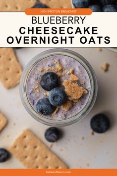 blueberry cheesecake overnight oats in a glass with crackers on the side