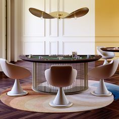 an elegant dining table and chairs in a room