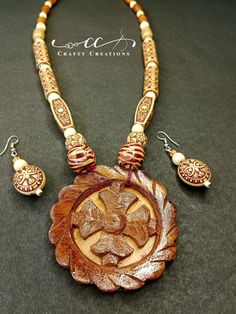 🌿 Elevate Your Style with Handcrafted Wooden Elegance! 🌿 Discover the perfect blend of nature's charm and artisan craftsmanship with our exquisite Artisan Crafted Wooden Necklace and Earrings Set. Meticulously designed and handcrafted, this jewelry ensemble embodies the beauty of sustainable materials and artistic expertise. 🌟 Key Features: 🌸 One-of-a-kind Design: Each necklace and earring is uniquely crafted, ensuring that you possess a piece of wearable art that's unlike any other. 🌸 Natu Traditional Necklace As A Gift, Traditional Natural Color Necklace For Gift, Traditional Wooden Beads For Gifts, Traditional Wooden Beads As Gift, Traditional Round Wooden Beaded Necklaces, Traditional Beaded Necklaces As Gift, Traditional Natural Beaded Necklaces As Gift, Traditional Natural Beaded Necklaces For Gifts, Rustic Large Beads Jewelry As Gift