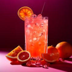 an orange and grapefruit cocktail with ice, garnishes and fruit