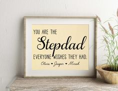 a sign that says you are the stepdad everyone wishes they had on it next to a potted plant