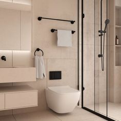 a bathroom with a toilet, sink and shower stall in the middle of it's walls