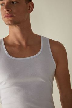 Sleeveless tank top made from Supima® cotton with wide straps, a round neckline and ribbing. It is simple and comfortable, making it ideal for wearing either as underwear or outerwear to suit the occasion. Undershirt Tank Top, Swimsuit Fabric, Supima Cotton, Ribbed Tank Tops, Cotton Tank Top, Sleeveless Tank, Sleeveless Tank Top, Mens Tank Tops, Round Neckline