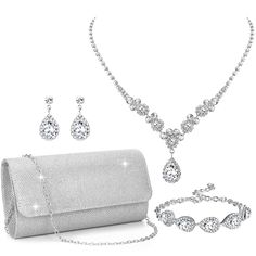 PRICES MAY VARY. PROM JEWELRY SETS SILVER: Silver jewelry set has 4 items, including a silver clutch, rhinestone bracelet, silver necklace and earring set. Silver prom jewelry set makes you elegant and fashionable, creating your own style. The shiny appearance of the crystal jewelry set allows you to stand out in crowds anytime, anywhere. The silver prom accessories will be a crucial step on your fashion path COSTUME JEWELRY FOR WOMEN: Rhinestone accessories for women is made of quality material Jewelry For Prom, Homecoming Jewelry, Silver Prom Jewelry, Rhinestone Accessories, Prom Necklace, Prom Jewelry Sets, Prom Purse, Prom Necklaces, Prom Accessories