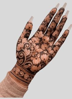 a woman's hand with hennap on it and flowers painted on the palm