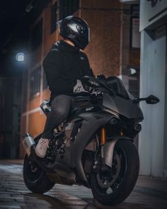 a man riding on the back of a motorcycle