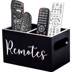 four remotes in a black box with the word remotes written on it and three different types of remotes