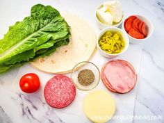 the ingredients are laid out on the counter to make wraps