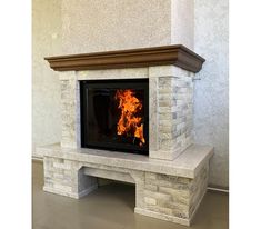 a fireplace with a fire burning inside of it in a living room next to a wall