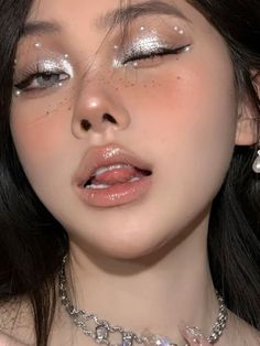 glitter eyeshadow look: metallic silver with gems Prom Makeup Looks Rhinestones, Makeup 2025 Trends, Asian Fairy Makeup, Silver Eye Makeup Look, Pearly Makeup Look, Makeup With Beads, Moon Makeup Aesthetic, Mermaid Pearl Makeup, White Pearl Makeup