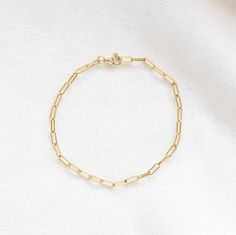 Trendy, light, and simple. Our paper clip bracelet is the perfect addition to everyday wear. Handmade right here in our store in Steamboat Springs, CO. All our jewelry is gold-filled offering long-lasting wears affordable to everyone. 18K gold filled Available in Sizes; 6.5" and 7" Care: polish occasionally. avoid exfoliating scrubs and chlorine. Modern Gold Plated Paperclip Bracelet For Everyday Wear, Modern Gold Plated Paperclip Bracelet For Everyday, Simple Everyday Paperclip Chain Jewelry, Gold Plated Link Paperclip Bracelet, Dainty 14k Gold-filled Paperclip Bracelet For Everyday, Dainty 14k Gold Filled Paperclip Bracelet For Everyday, Everyday Gold Plated Paperclip Bracelet With Oval Link, Delicate Everyday Paperclip Bracelet, Modern Everyday 14k Gold Filled Bracelet