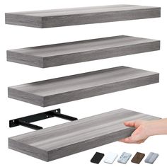 three shelves with different types of wood and metal brackets, one holding the top shelf