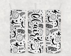 two white tumblers with volleyball designs on them