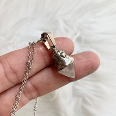 This handmade Crystal Quartz urn pendant is designed to hold a small, sacred keepsake close to your heart. The top of the pendant unscrews to reveal a discreet compartment above the solid Quartz crystal, capable of holding approximately a quarter teaspoon of ashes. Each pendant is lovingly handcrafted, and natural variations in the crystal and metalwork ensure no two are exactly alike." - The container is located above the crystal, while the Quartz remains solid - Crafted from a silver mixture of tin and copper, melted and hand-painted for a rustic, aged look - Comes with a stainless steel chain of your choice, including a 30" chain that can easily be cut down at home Important Information: These pendants are made to order, with a processing time of 5 business days. Once your order is made Sacred Objects, Cremation Necklaces, Pet Urn, Memorial Pendant, Urn Pendant, Urn Necklace, Urn Necklaces, Pet Urns, Small Containers