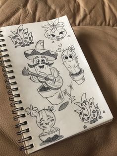 a notebook with drawings of cartoon characters on it