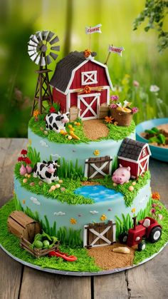 a cake decorated with farm animals and windmills is on a table in front of a green background