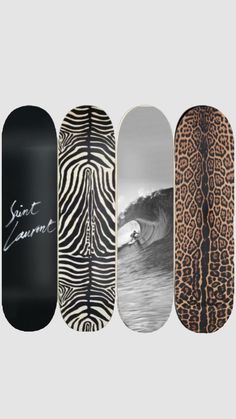 four skateboards with different designs on them