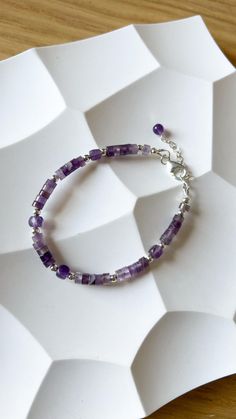 Shiny violet amethyst bracelet. It's original jewelry, beaded by hand, using only natural stone beads. Check my shop to see more matching bracelets:  https://www.etsy.com/shop/JewelsByMuzA?ref=shop-header-name&listing_id=1664043490&from_page=listing§ion_id=47678614 LENGTH: 15 cm + 3 cm chain. CLOSURE: lobster claw. MATERIALS: 4mm faceted amethyst square beads, furniture can be: stainless steel, goldened stainless steel or 925 silver. PLEASE NOTE, COLORS might be different because of the nature o Gift Amethyst Gemstone Beaded Bracelets, Amethyst Gemstone Beaded Bracelets As Gift, Amethyst Gemstone Beaded Bracelets For Gift, Amethyst Gemstone Beads Bracelets As Gift, Amethyst Gemstone Beaded Bracelet Gift, Sterling Silver Spiritual Beaded Bracelets With Gemstones, Spiritual Sterling Silver Beaded Bracelets With Gemstone, Amethyst Gemstone Beads Bracelet As Gift, Amethyst Gemstone Beads Bracelet For Gifts