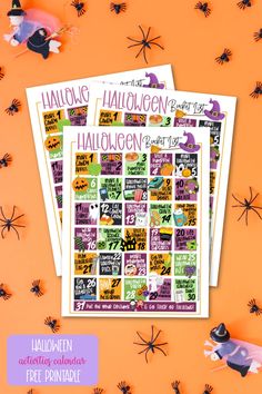 two halloween stickers on an orange background with black and white spider webs around them