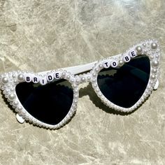 💖💖 Step into the enchanting world of our meticulously crafted heart-shaped sunglasses, where passion meets precision in every detail. Adorned with exquisite pearl embellishments, these sunglasses are a testament to artisanal artistry, perfect for your bridal ensemble. 💍💍 Elevate your bridal style effortlessly with these stunning sunglasses, designed to enhance your special moments. Whether it's your wedding day, honeymoon, bridal shower, or bachelorette party, let these shades add a touch of elegance to your bridal look. 📸📸 Planning an engagement photoshoot? Embrace the journey to "I do" with these sunglasses as the perfect accessory. Treat yourself or surprise a soon-to-be bride - these shades are guaranteed to sparkle and shine! 🎨🎨 Capture pure joy in every selfie with these pear White Heart-shaped Sunglasses For Beach, Heart-shaped Glass Sunglasses For Gift, Heart-shaped Glass Sunglasses As Gift, White Heart-shaped Beach Sunglasses, White Heart-shaped Sunglasses With Gradient Lenses, White Sunglasses With Gradient Lenses As Gift, White Sunglasses With Gradient Lenses As A Gift, White Sunglasses With Uv Protection As Gift, Heart-shaped Sunglasses For Summer Weddings