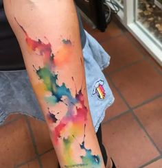 a person with a colorful tattoo on their arm